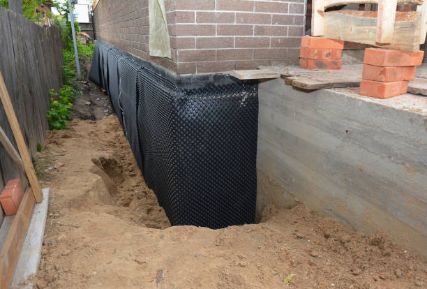 Happy homeowners after waterproofing job in Reed City